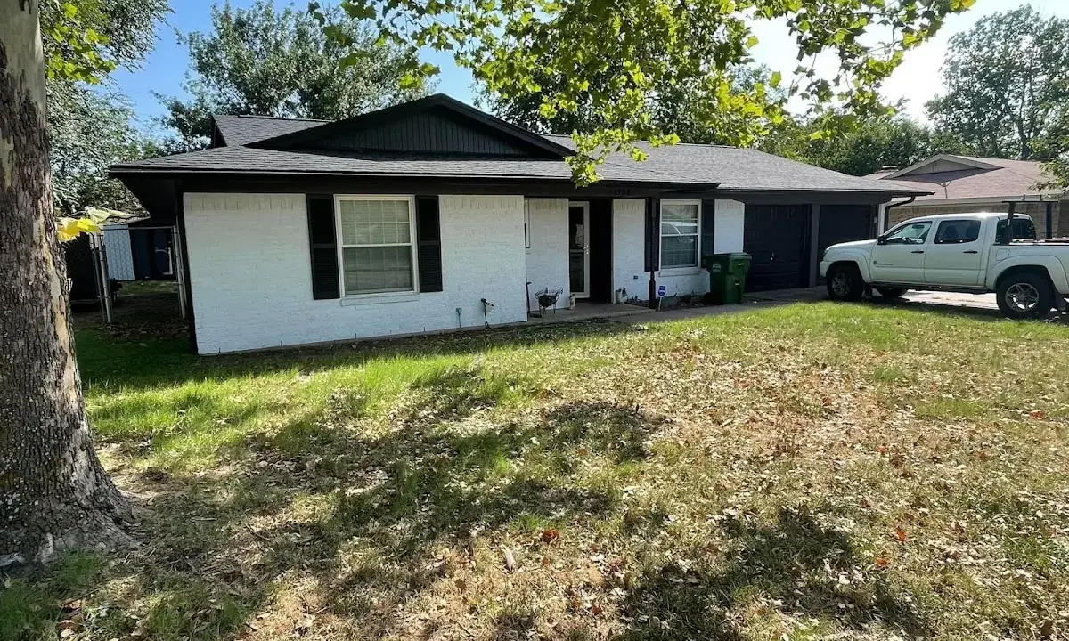 Professional roofing crew working on a residential roof in Cottage Grove
